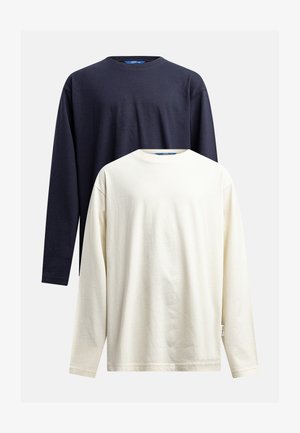 Deux t-shirts à manches longues : l'un bleu marine et l'autre cassé. Les deux ont des encolures rondes et une texture en coton douce et lisse.