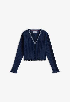 Temno modra pletena jopa z belimi črtami na V-izrezu, zapiranjem na gumbe, dolgimi rokavi, valovitim spodnjim robom in logotipom Tommy Hilfiger na prsih.