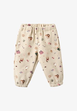 Beige mönstrade barnbyxor med elastisk midja, med mönster av godis, prydnader och djur över hela tyget.
