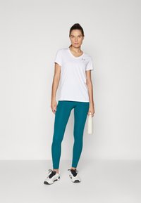 Under Armour Leggingek - hydro teal/white