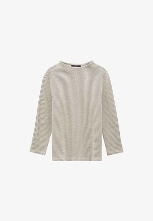 Maglia a maniche lunghe color beige con un motivo a trama a griglia. Scollatura rotonda e taglio dritto, realizzata in un tessuto morbido e leggero.