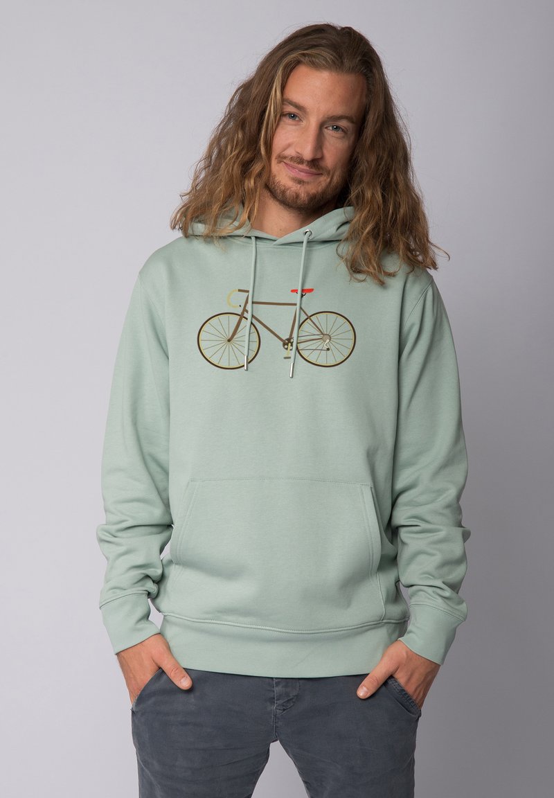 Mintgrüner Hoodie mit einem grafischen Design eines Fahrrads in Braun und einem roten Sattel. Er verfügt über eine Fronttasche und ein Kordelzug an der Kapuze.