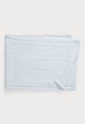 Light blue knitted blanket with textured cable pattern. Edges are neatly finished, creating a soft and cozy appearance.
