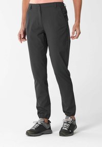 Pantalones ligeros negros con puños elásticos, dos bolsillos laterales y cierre de cremallera, hechos de una tela suave y transpirable.