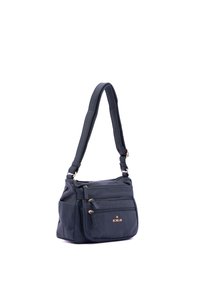 Navy blue leather crossbody bag featuring two front zip pockets, a single adjustable strap, and gold-tone hardware accents.