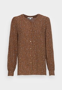 Blusa marrone a maniche lunghe con chiusura a bottoni, caratterizzata da piccoli motivi floreali multicolori e polsini arricciati per un tocco di tessitura e stile.