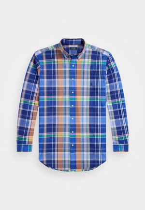 Chemise à manches longues boutonnée avec un motif à carreaux bleu, vert, orange et blanc, et un col boutonné.