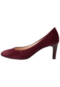 Burgundy mockasinhigh heels med rund tå och medelhög blockklack. Slät textur, minimal design och ingen synlig dekoration.