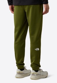The North Face M REAXION FLEECE JOGGER - EU - Trainingsbroek - woodland green