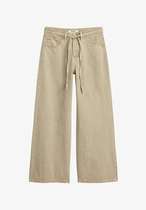 Beige wide-leg pants with front pockets, belt loops, and a fabric tie belt, made from denim material.