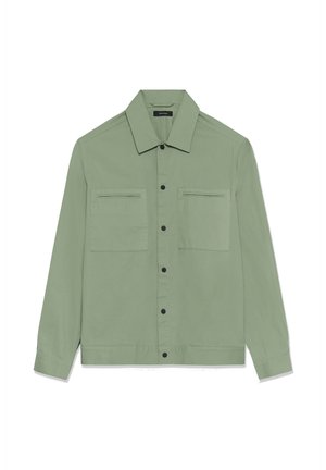 Light green long-sleeve button-up shirt jacket with two chest pockets and black snap buttons.