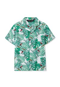 Camicia a maniche corte con uno sfondo bianco, caratterizzata da un vivace motivo di dinosauri verdi, circondati da foglie tropicali e occhiali da sole.