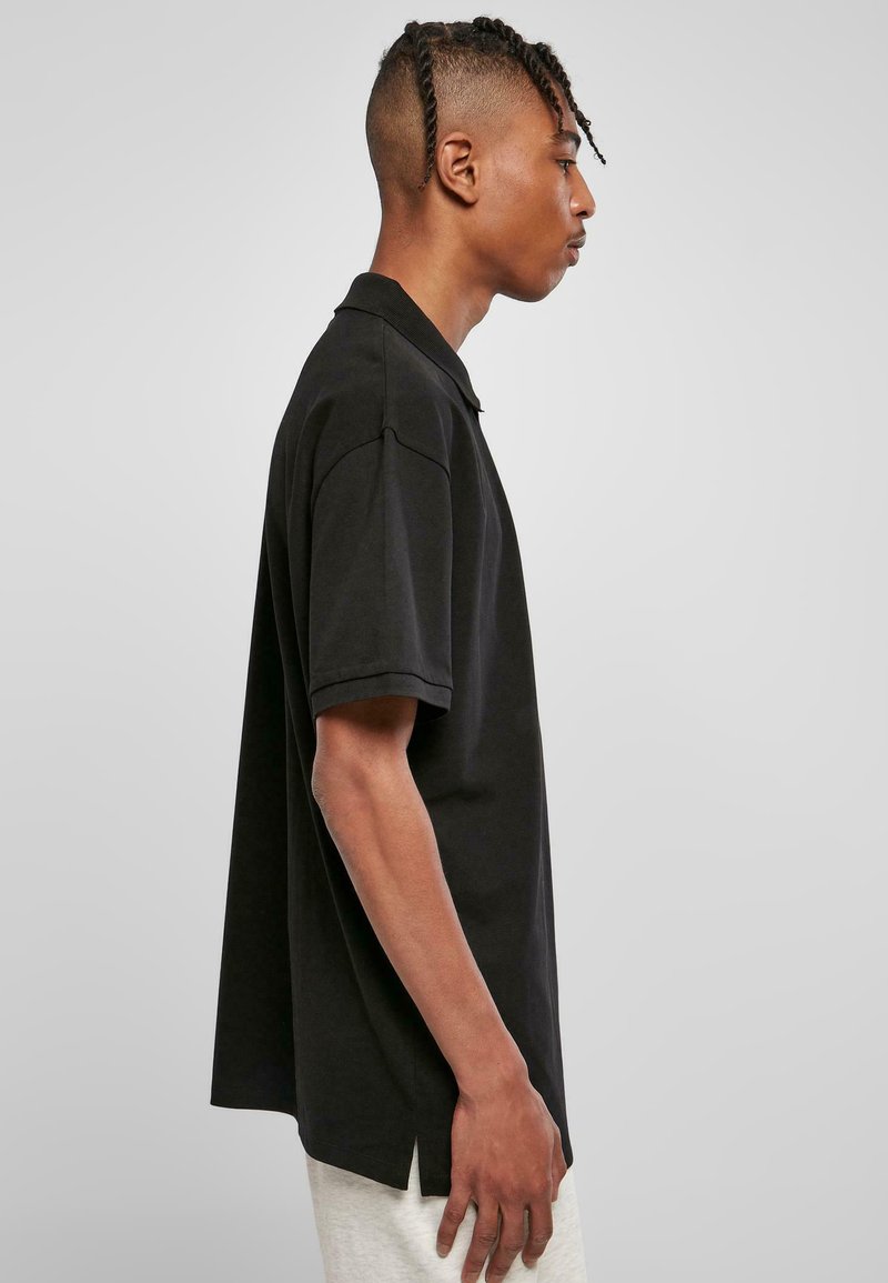 oversized black polo shirt