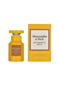 Gelber Glasparfümflakon mit einem abgerundeten Deckel, beschriftet mit "Abercrombie & Fitch Authentic Self", neben einer passenden gelben Schachtel.