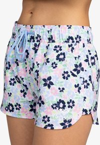 Shorts floraux bleu clair, ornés de fleurs bleu marine, roses et vertes, avec une taille élastique et un cordon de serrage. Logo Roxy au bas.