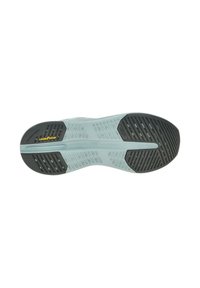 Shoe sole with gray and black tread, featuring Goodyear logo and patterned grip areas for traction and stability.