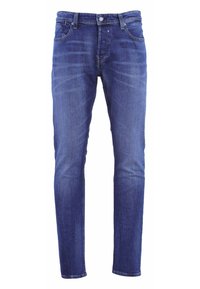 Jean en denim de couleur bleu foncé, coupe slim, avec cinq poches, une fermeture à bouton et glissière, présentant un léger délavage et des détails de couture.