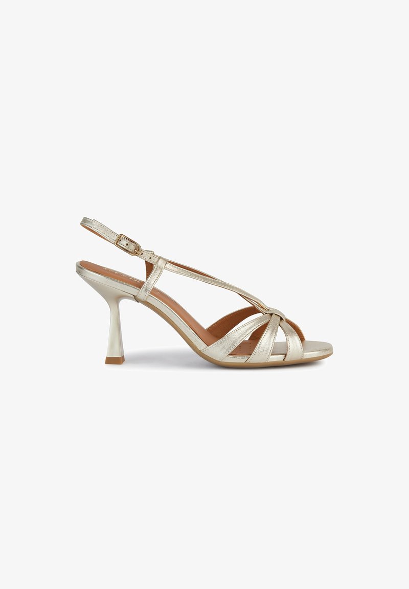 Guldmetalliska slingback-hälar med en avsmalnande stilettklack, med en korsad framsidesdesign och en mjuk innersula.