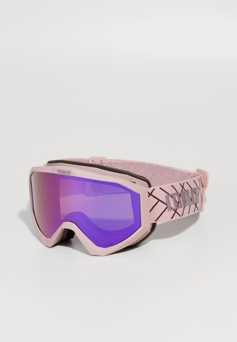 Skibril met een roze montuur, grote paarse getinte lens, verstelbare strap met een geometrisch patroon en schuimrubberen padding voor comfort.