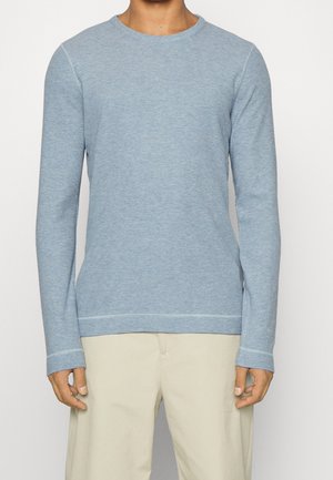 Stickad tröja - light blue