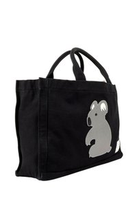 Sac cabas en tissu noir avec double poignée et un motif koala gris sur le devant, présenté sur fond blanc.
