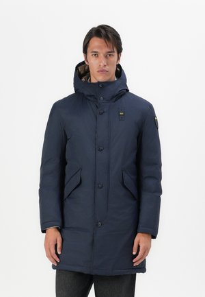 Navy blue parka jacket with hood, featuring a zip and button closure, two side pockets, and a quilted lining visible at the collar.