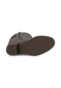 Botte cheville en cuir marron avec un extérieur lisse et une semelle en caoutchouc texturée. Dispose d'une fermeture éclair latérale et d'une cheville rembourrée pour plus de confort.