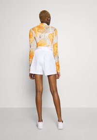 Nike Sportswear Träningsbyxor - white