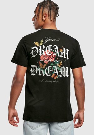 Black cotton t-shirt featuring bold white lettering with floral graphics, including roses and butterflies, on the back. Casual fit and short sleeves.