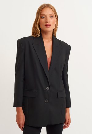 Eine Rangliste der qualitativsten Longblazer grau