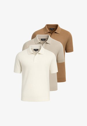 Kolme lyhythihaista polo-oloa vaalean beige, kermanvärinen ja tansinvärinen. Valmistettu tekstuurimaisesta kankaasta, jossa on ribbireunat kauluksessa ja hihoissa.