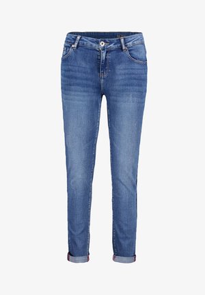 Niebieskie dżinsy o prostym kroju, pięcioma kieszeniami, z zapięciem na guziki z przodu i podpiętymi mankietami. Mają wyblakły kolor i subtelne przetarcia.