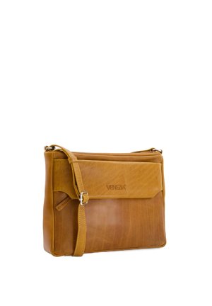 Leather crossbody bag in tan, featuring a smooth texture, a flap closure, and an adjustable strap. Marked with "VENEZIA" logo.