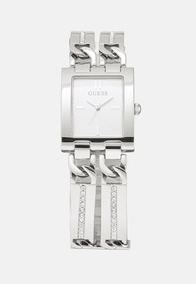 Silver metal watch with a square face, link bracelet, and crystal accents on the band. The dial features minimalist hour markers.