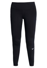 Mustat urheiluleggingsit, joissa on korkea vyötärö, ja joissa on rei'itetyt yksityiskohdat alhaalla lahkeissa sekä pieni valkoinen Nike-logo sivussa.