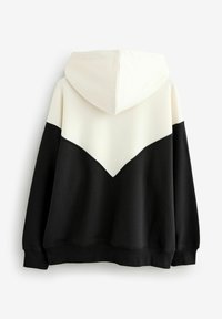Hoodie met een chevron ontwerp, de ene helft crèmekleurig en de andere helft zwart. Gemaakt van een zachte stof met ribbelboorden en een ribbelzoom.