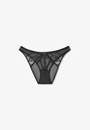Tanga negro de encaje con paneles de malla, que presenta un patrón floral central, cierre de cremallera y una delgada cinturilla elástica. Textura suave en general.