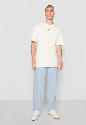 Karl Kani ESSENTIAL TEE UNISEX 3 PACK - T-shirt imprimé - light sand/ sand/ dark brown