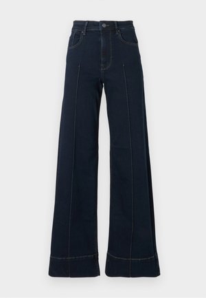 Tumedad sinise laiad püksid kõrge vöökohtaga, millel on esipockets ja nähtavad õmblused. Valmistatud denimpurust, millel on sile tekstuur.