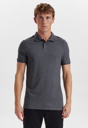 Dark gray polo shirt made of soft fabric, featuring a three-button placket and short sleeves. Minimalistic design with subtle branding.