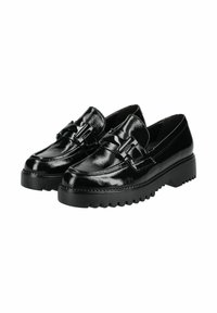 Mocassins en cuir noir brillant avec semelles épaisses à rainures et boucle décorative sur le dessus, conçus pour un usage décontracté ou formel.