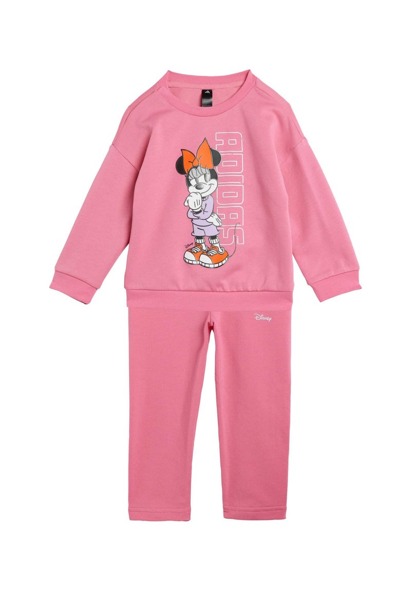 Rosa sweatshirt och byxor i set med en grafik av en karaktär med en orange rosett och skor, tillverkad av mjukt bomullsblandat material.