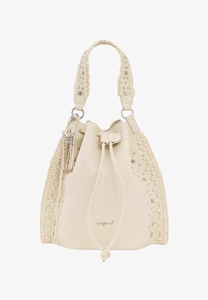 Sac à main seau en cuir crème avec côtés tressés, clous en métal, pompon, fermeture à cordon et poignée rembourrée unique.