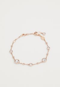 Pulseira em ouro rosado feita de delicadas ligações de corrente, apresentando cristais transparentes redondos em configurações circulares, com um fecho de lagosta.