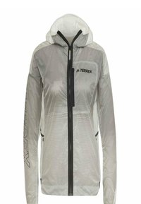 Veste à capuche Adidas Terrex gris clair avec fermeture éclair noire et logo sur la poitrine, texte noir "TERREX" sur la manche gauche.