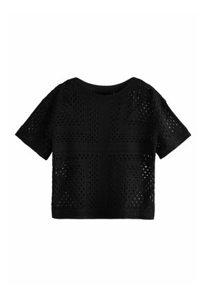 Haut en tricot noir à manches courtes avec un motif texturé en tricot ouvert et un col rond, offrant une coupe carrée et décontractée.