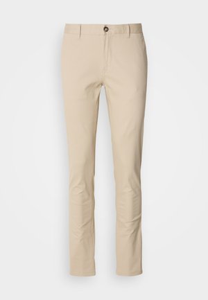 Beige cotton trousers with a slim fit, featuring a button closure, subtle texture, and standard pockets. Plain design, no patterns or accents.