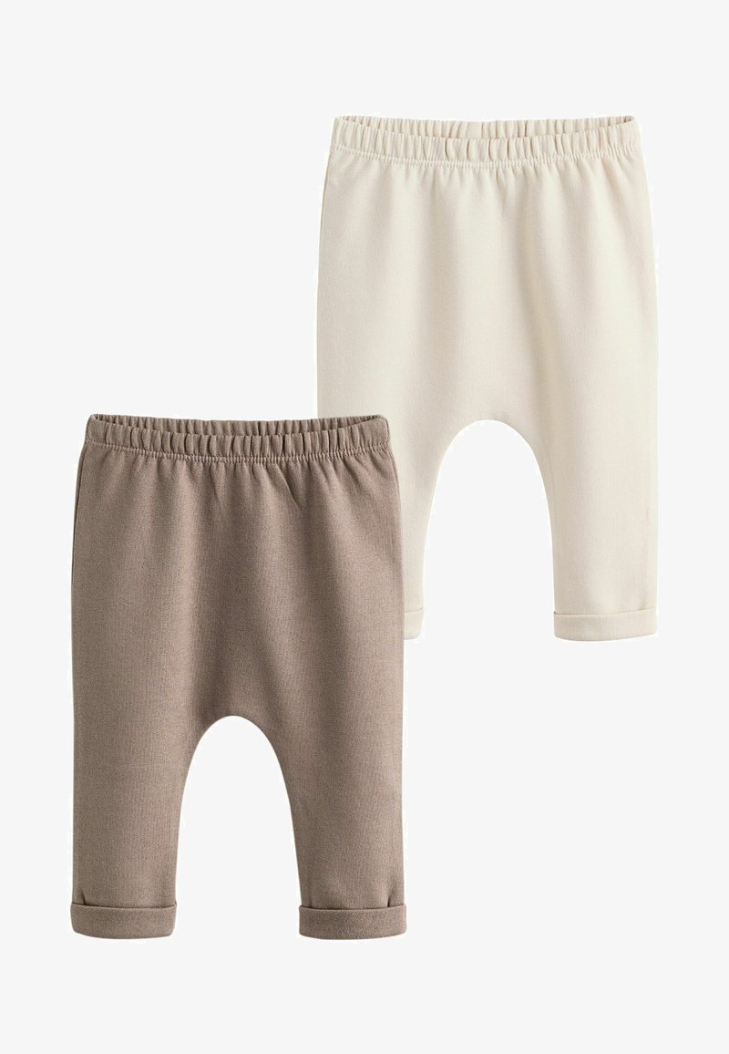 Two pairs of baby leggings with elastic waistbands, one beige and one light cream, both with rolled cuffs.