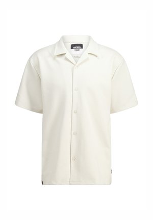 Korte mouwen, crèmekleurig shirt met een textuurpatroon, knoopsluiting aan de voorkant en een klassieke kraag. Merkenlabel zichtbaar in de halslijn.