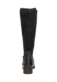 Bottes noires jusqu'aux genoux en suède et en cuir. Présentent un haut légèrement courbé, une finition texturée et un petit talon carré. Détail ajustable à l'arrière avec un lien.